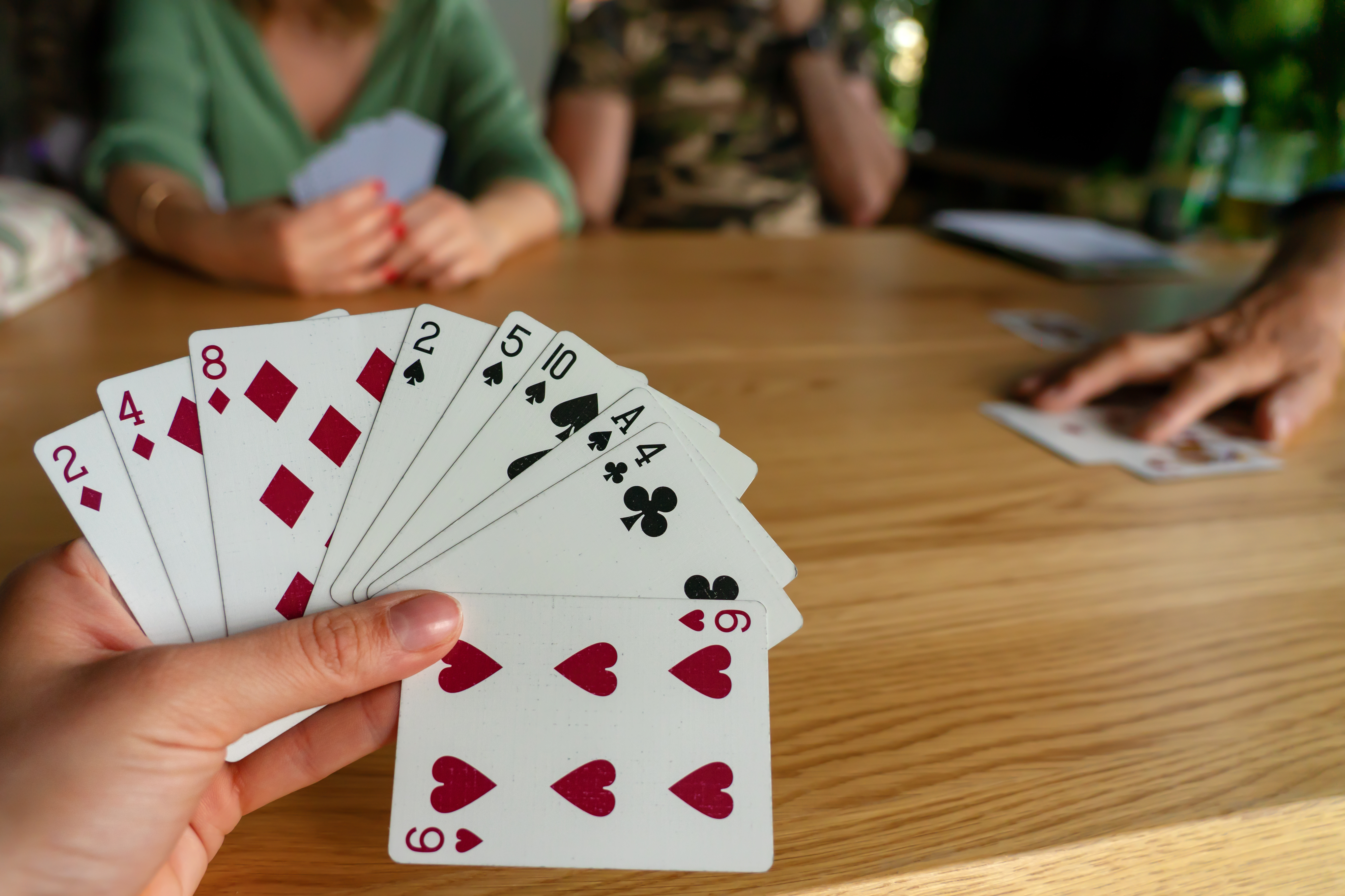 Group of friends playing cards.